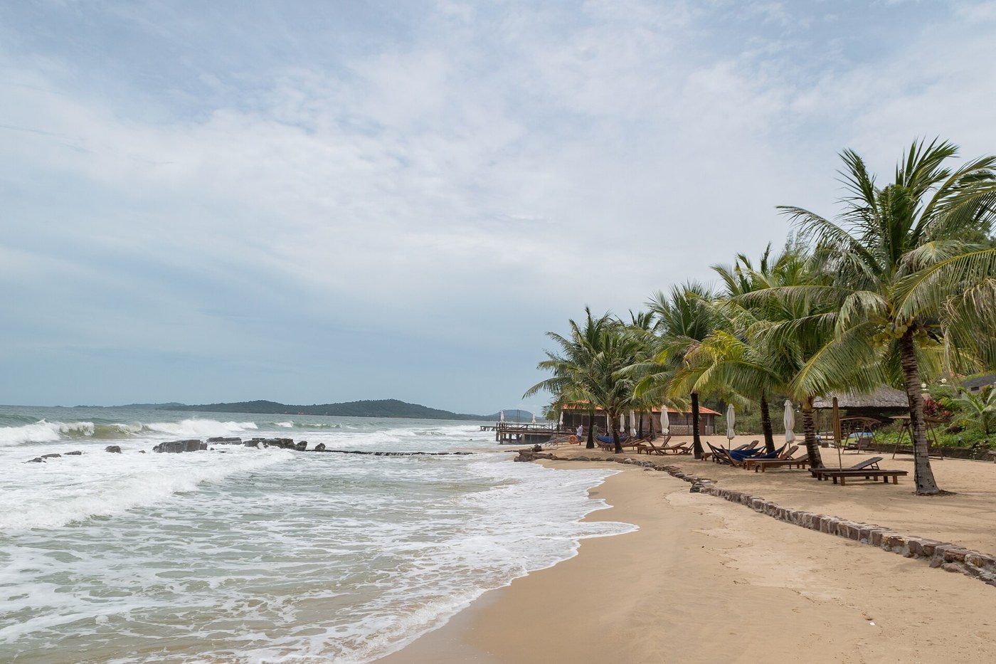 Tropical beach illustrating essential sun protection for travel