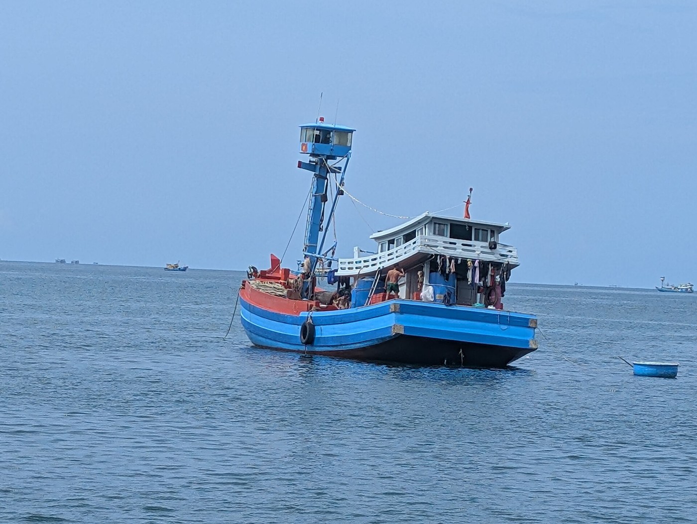 Fishing boats near the shore during a coastal journey